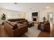 Cozy living room features a fireplace, comfortable seating, and neutral decor at 1701 Palmer Ave, Winter Park, FL 32789