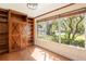 Bright office with large windows, built-in bookshelves and hardwood floors at 1701 Palmer Ave, Winter Park, FL 32789