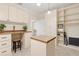 Office featuring a desk, built-in shelving, and natural light at 1701 Palmer Ave, Winter Park, FL 32789