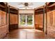 Bright office boasts built-in storage, natural light, and hardwood floors at 1701 Palmer Ave, Winter Park, FL 32789