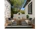 Stylish outdoor lounge space features seating and a decorative water feature, perfect for relaxation and entertaining at 1701 Palmer Ave, Winter Park, FL 32789