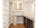Pantry features custom shelving, cabinets and counter space for storing food and beverages at 1701 Palmer Ave, Winter Park, FL 32789