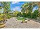 Inviting backyard pool area surrounded by lush greenery and a paver patio at 1701 Palmer Ave, Winter Park, FL 32789