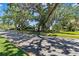Scenic street view showcasing the home's curb appeal and mature trees at 1701 Palmer Ave, Winter Park, FL 32789