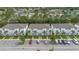 Townhomes feature well-manicured landscaping, ample parking, and stylish architectural details at 17522 Hidden Forest Dr, Clermont, FL 34714