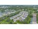 An aerial view shows the community layout with plentiful green spaces, ponds, and winding roads at 17522 Hidden Forest Dr, Clermont, FL 34714