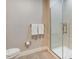 Modern bathroom features a glass door shower with gray tiling at 17522 Hidden Forest Dr, Clermont, FL 34714