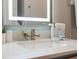 Modern bathroom featuring a lighted mirror and sleek fixtures at 17522 Hidden Forest Dr, Clermont, FL 34714