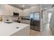 Modern kitchen with stainless steel appliances, quartz countertops and light wood cabinets at 17522 Hidden Forest Dr, Clermont, FL 34714