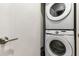 Laundry area features a stacked washer and dryer at 17522 Hidden Forest Dr, Clermont, FL 34714