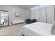Serene main bedroom boasts plush carpeting, a large window, and a stylish sitting area with comfortable chairs at 17522 Hidden Forest Dr, Clermont, FL 34714