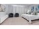 Serene main bedroom boasts plush carpeting, a large window, and a stylish sitting area with comfortable chairs at 17522 Hidden Forest Dr, Clermont, FL 34714