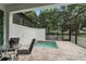 Outdoor patio area with a screened-in hot tub and green wall at 17522 Hidden Forest Dr, Clermont, FL 34714