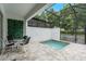 Outdoor patio area with a screened-in hot tub at 17522 Hidden Forest Dr, Clermont, FL 34714