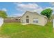 Spacious backyard with a well-maintained lawn and a private patio area, perfect for outdoor entertaining at 2104 Remington Pointe Blvd, Kissimmee, FL 34743