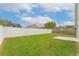 Expansive backyard with a well-maintained lawn and full perimeter fencing, offering privacy and security at 2104 Remington Pointe Blvd, Kissimmee, FL 34743