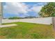 Large backyard with a well-maintained lawn and a privacy fence, providing a safe and secluded outdoor space at 2104 Remington Pointe Blvd, Kissimmee, FL 34743