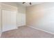 Bedroom featuring neutral carpeting, a vaulted ceiling, a standard closet and neutral paint at 2104 Remington Pointe Blvd, Kissimmee, FL 34743