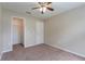 Bedroom with neutral carpeting, a standard closet, a ceiling fan, and neutral paint at 2104 Remington Pointe Blvd, Kissimmee, FL 34743