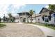 Elegant clubhouse with a porte-cochere entrance, well-maintained landscaping, and ample parking at 2168 Seagrass Pt # 424, Kissimmee, FL 34747