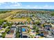 Scenic aerial shot of the neighborhood showcasing the homes, green spaces, and open land surrounding the community at 218 Castlemain Cir, Davenport, FL 33897