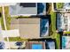 Overhead shot showcases a residential property with a swimming pool in a lush, green neighborhood at 218 Castlemain Cir, Davenport, FL 33897