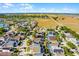 Scenic aerial shot of the neighborhood showcasing the homes, green spaces, and open land surrounding the community at 218 Castlemain Cir, Davenport, FL 33897