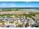 Aerial view of a property in a residential area, highlighting landscaping, proximity to other homes, and green spaces at 218 Castlemain Cir, Davenport, FL 33897