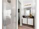 Bathroom featuring a vanity with a sink and a walk-in shower at 218 Castlemain Cir, Davenport, FL 33897