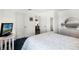 Neutral bedroom with a queen bed, light walls, and a dresser on the side at 218 Castlemain Cir, Davenport, FL 33897