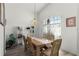 Dining room featuring a table set for six, complemented by natural light from a window at 218 Castlemain Cir, Davenport, FL 33897