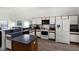 Functional kitchen with white appliances, wood cabinets and plenty of counter space for cooking at 218 Castlemain Cir, Davenport, FL 33897