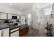 Well-lit kitchen with white cabinets, ample counter space, and views into the dining room at 218 Castlemain Cir, Davenport, FL 33897