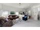 Open-concept living room seamlessly connects to the kitchen, providing an inviting atmosphere at 218 Castlemain Cir, Davenport, FL 33897