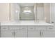 Bathroom featuring double sinks with white cabinets and modern fixtures at 2192 Seagrass Pt # 427, Kissimmee, FL 34747