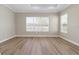 Spacious bedroom with two large windows and stylish flooring at 2192 Seagrass Pt # 427, Kissimmee, FL 34747