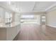 Open concept kitchen featuring stainless steel appliances and light wood flooring at 2192 Seagrass Pt # 427, Kissimmee, FL 34747