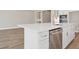 Bright kitchen featuring white cabinets, stainless steel appliances, and a large island at 2192 Seagrass Pt # 427, Kissimmee, FL 34747