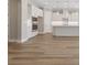 Modern kitchen featuring white cabinets and countertops with light wood flooring at 2192 Seagrass Pt # 427, Kissimmee, FL 34747