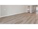 Spacious living room featuring light wood flooring and an open floor plan at 2192 Seagrass Pt # 427, Kissimmee, FL 34747