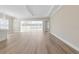 Bright living room with light wood flooring and sliding glass doors leading to the backyard at 2192 Seagrass Pt # 427, Kissimmee, FL 34747