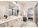 Bathroom featuring double sinks, quartz countertops, modern vanity, and walk-in shower at 2277 Crossbow St, Clermont, FL 34715