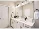 Bathroom featuring a double vanity with modern fixtures and ample storage at 2277 Crossbow St, Clermont, FL 34715