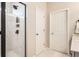 Bathroom featuring a glass-enclosed shower, neutral tones and a closet at 2277 Crossbow St, Clermont, FL 34715