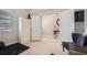 Bright bedroom with wardrobe, light hardwood floors, and inviting blue chair at 2277 Crossbow St, Clermont, FL 34715