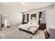 Cozy bedroom with two windows, side tables, black-out curtains and a comfortable workspace at 2277 Crossbow St, Clermont, FL 34715