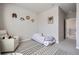Bedroom with a daybed, whimsical wall decor, and cozy seating area at 2277 Crossbow St, Clermont, FL 34715