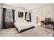 Relaxing bedroom with black-out curtains, neutral decor, and a comfortable workstation at 2277 Crossbow St, Clermont, FL 34715