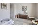 Bedroom with a modern dresser, patterned rug, and playful decor at 2277 Crossbow St, Clermont, FL 34715