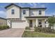 Charming two-story home featuring a two-car garage, and well-maintained landscaping at 2277 Crossbow St, Clermont, FL 34715